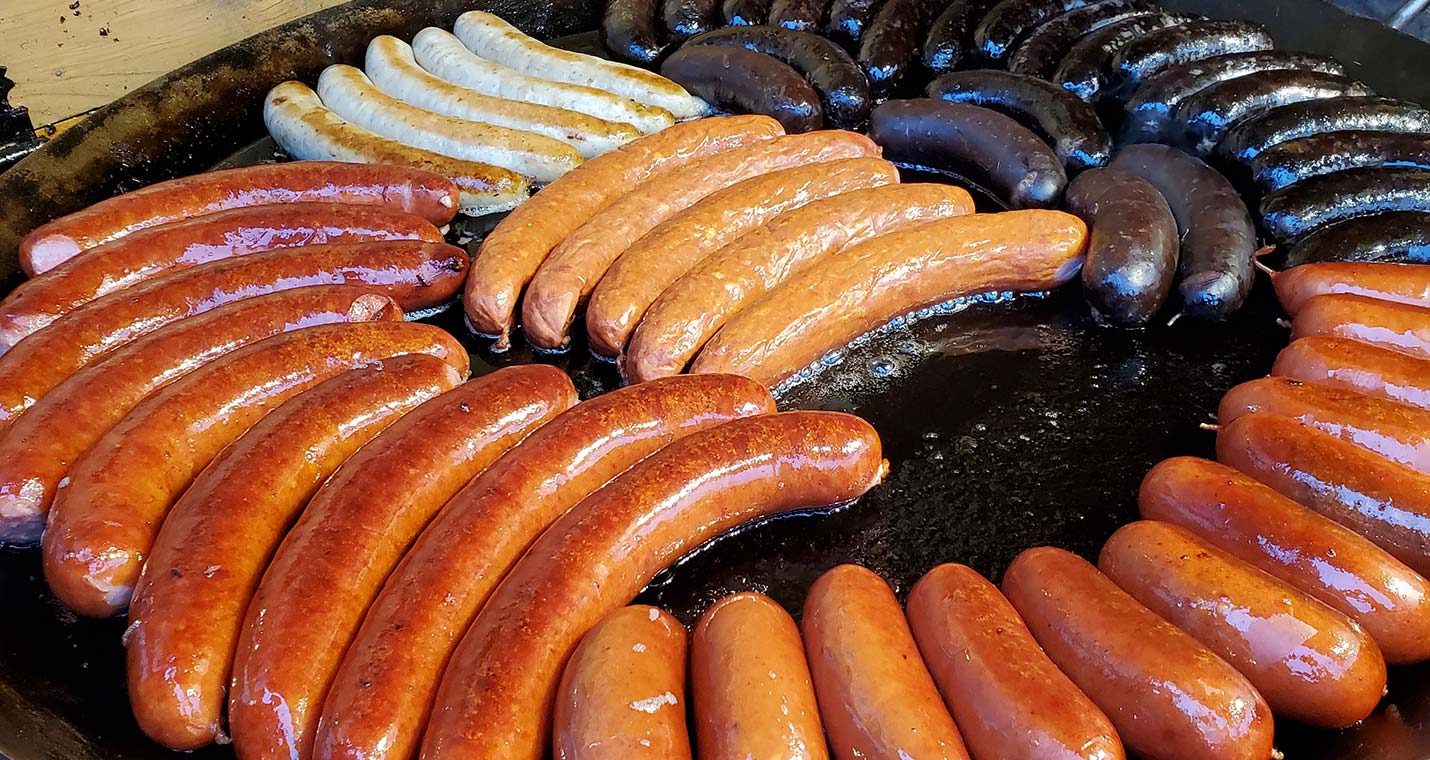 Sausage Assortment on a Grill, photo by Hasmik Ghazaryan Olson via Unsplash.